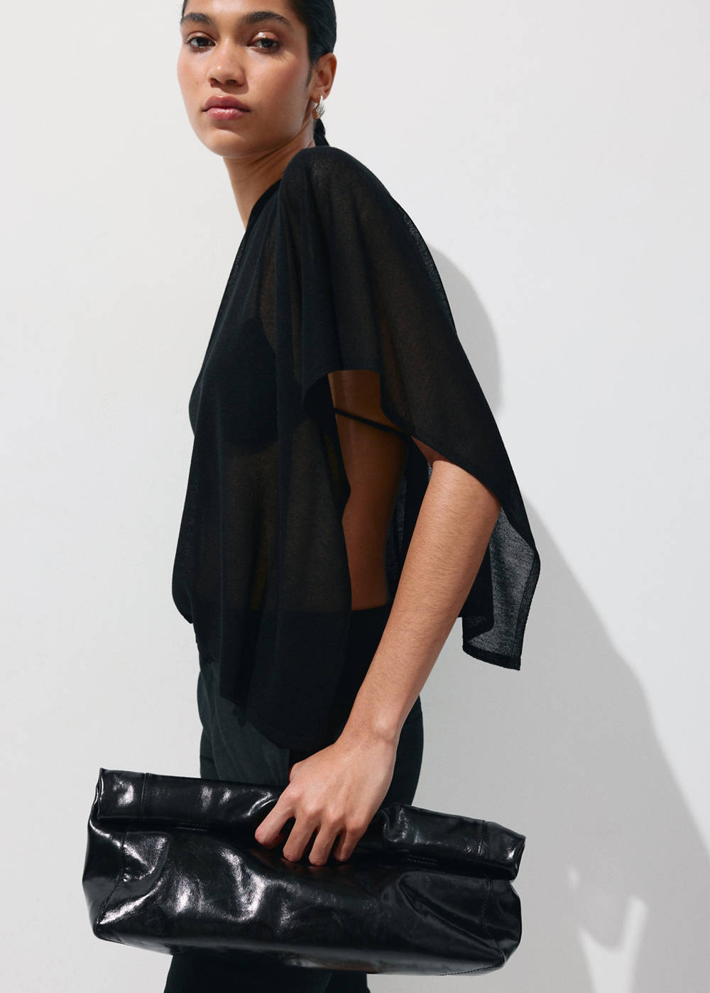 Asymmetrical knitted cape