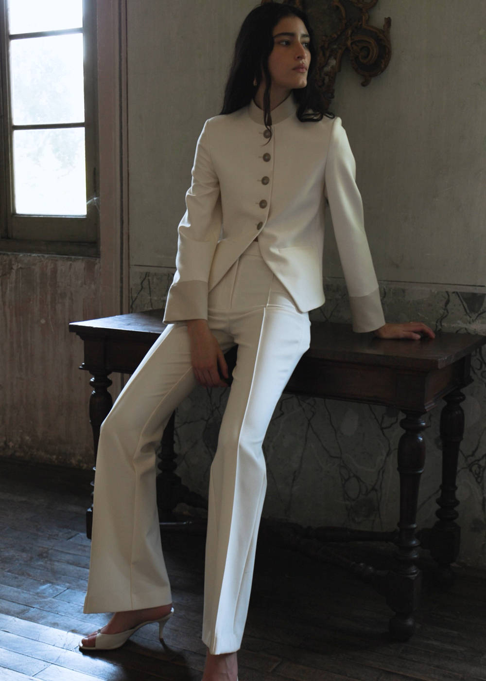 Jacket with jewel-button strip collar
