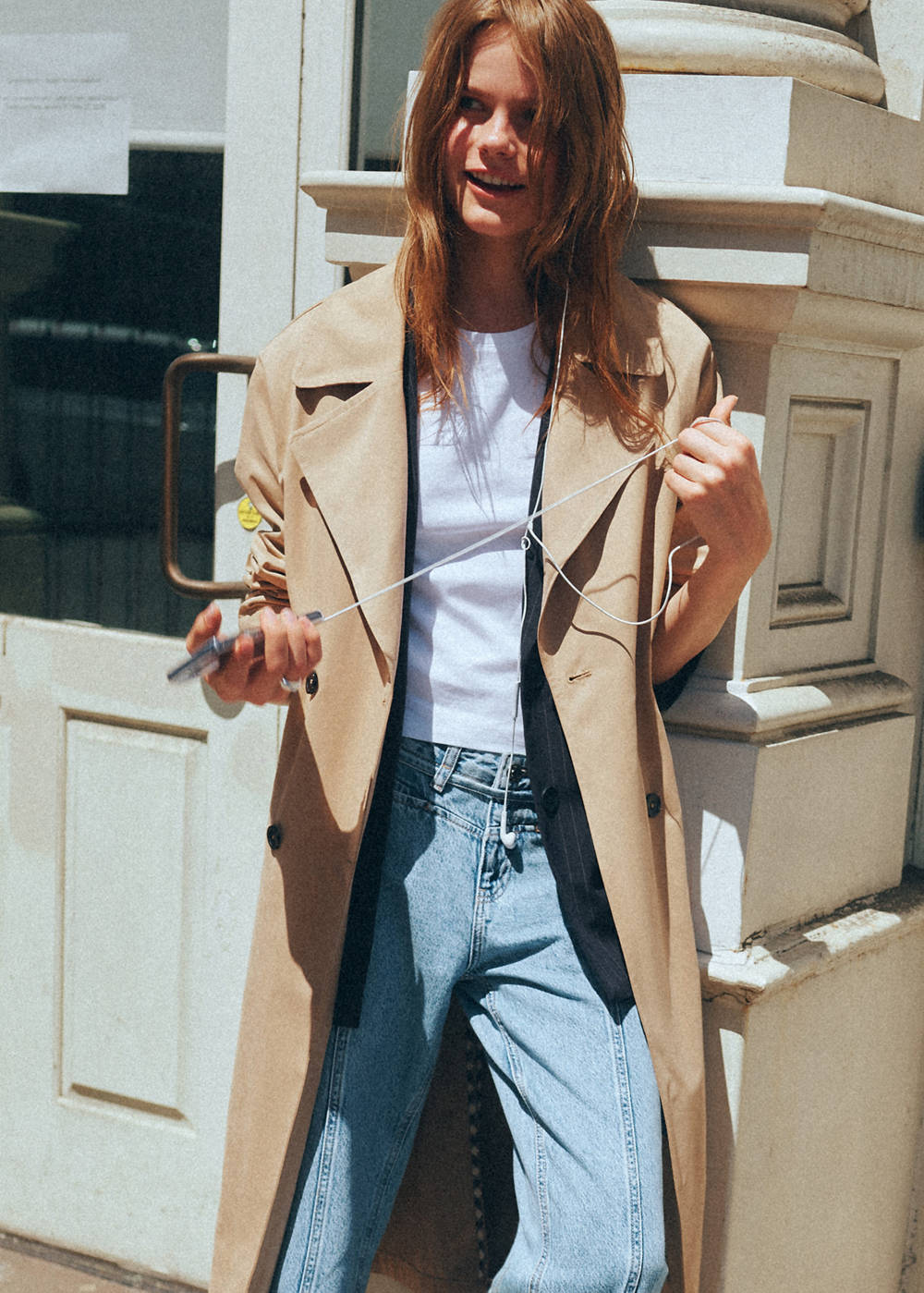 Double-breasted belted trench coat