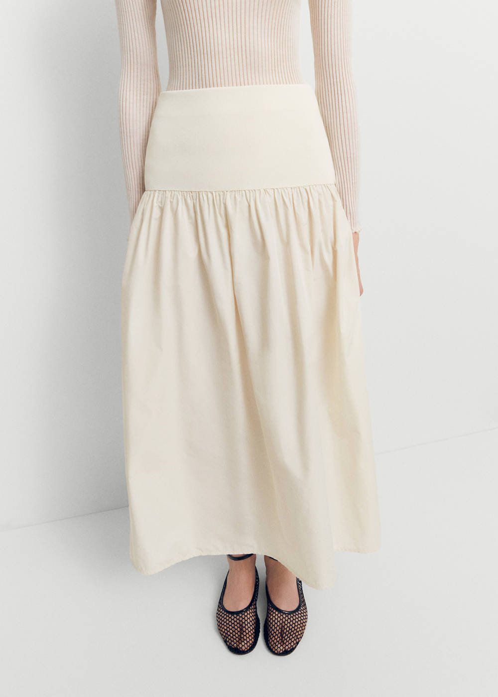 Elastic panel flared skirt